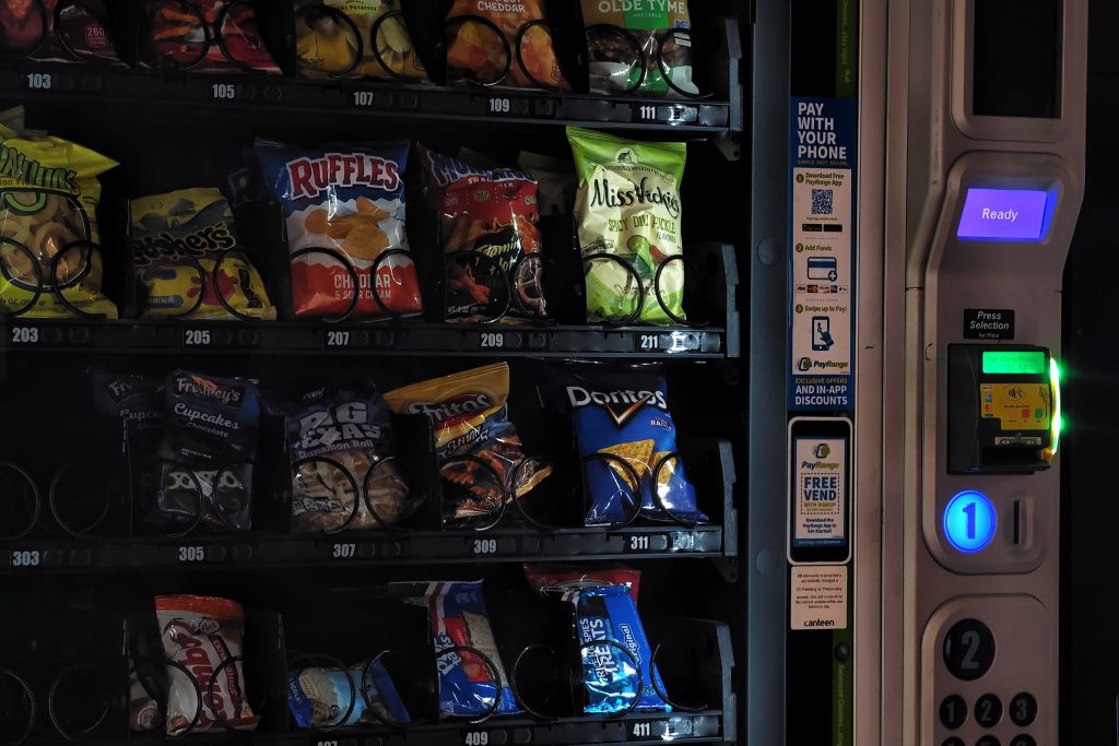 A display of chips in the window of the vending machine.